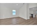 Spacious dining area with hardwood floors and access to kitchen at 4423 Sw 171St Pl, Ocala, FL 34473