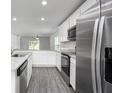 Modern kitchen with stainless steel appliances and granite countertops at 16448 Sw 17Th Terrace Rd, Ocala, FL 34473