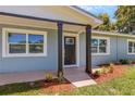 Front door view of newly renovated home with modern entryway at 3419 Lisa Ln, Lakeland, FL 33801