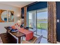 Elegant dining room with patio doors and lake view at 140 Hickory Course Trl, Ocala, FL 34472