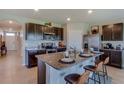 Modern kitchen with island and stainless steel appliances at 140 Hickory Course Trl, Ocala, FL 34472