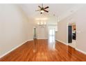 Bright living room with hardwood floors and high ceilings at 31817 Sunpark Cir, Leesburg, FL 34748