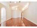 Spacious living room featuring hardwood floors and high ceilings at 31817 Sunpark Cir, Leesburg, FL 34748