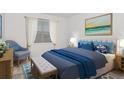 Bright bedroom with a comfortable bed and ocean-themed decor at 4382 Sw 84Th Street Rd, Ocala, FL 34476