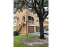 Condo building exterior showcasing a private entrance and parking area at 12031 Villanova Dr # 110, Orlando, FL 32837