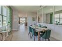 Open concept dining area with a view into the kitchen and living areas at 4063 Nw 44Th Cir, Ocala, FL 34482