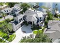 Luxury home with a large pool and private dock on the waterfront at 9202 Bay Point Dr, Orlando, FL 32819