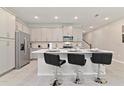 Modern kitchen with stainless steel appliances and an island at 2174 Fleming Mist Pl, Kissimmee, FL 34747