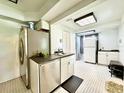 Updated kitchen with stainless steel appliances and dark countertops at 540 Francis Blvd, Lakeland, FL 33801