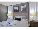 Bright bedroom with king-size bed and stylish decor at 2857 Bookmark Dr, Kissimmee, FL 34746
