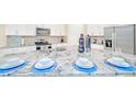 Kitchen island with granite countertop, perfect for casual dining at 1959 Tropical Palms Cir, Kissimmee, FL 34747