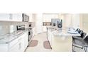 Modern kitchen with stainless steel appliances and granite countertops at 1959 Tropical Palms Cir, Kissimmee, FL 34747