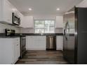 Modern kitchen with stainless steel appliances and granite countertops at 604 W 12Th St, Lakeland, FL 33805