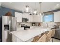 Modern kitchen with stainless steel appliances and island at 9088 Wildlight Trl, Wildwood, FL 34785