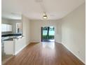 Bright living room with hardwood floors and access to backyard at 2112 Calabria Ave, Davenport, FL 33897