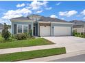 Beautiful two-story house with a three-car garage at 7474 Sw 78Th Ter, Ocala, FL 34481