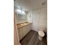 Bathroom features a toilet and updated flooring at 2729 N Poinciana Blvd # 117, Kissimmee, FL 34746