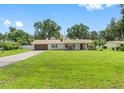 Ranch style home with a spacious yard and a two-car garage at 4314 Ridge Rd, Lakeland, FL 33811