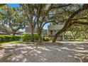Modern home nestled under large shade trees at 6318 Cedar Ln, Lakeland, FL 33813