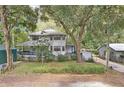 Two-story house surrounded by lush trees at 3603 Cr 626N, Bushnell, FL 33513