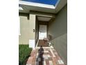 Front entry with covered porch and bench at 718 Saratoga Ave, Lakeland, FL 33815