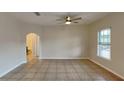 Living room with tile floors and view of bathroom at 2217 Betsy Ross Ln # A, St Cloud, FL 34769