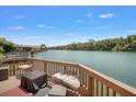 Deck overlooking a tranquil river with seating and beautiful views at 696 Caribbean Dr, Lakeland, FL 33803