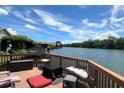 Relaxing deck with river views, cushions, and a fire pit at 696 Caribbean Dr, Lakeland, FL 33803