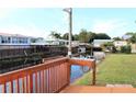 Relaxing view of the canal from a wooden deck with a small sink at 535 Minnow Ct, Kenansville, FL 34739