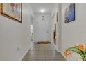 Bright and airy entryway with tile flooring and access to living areas at 1801 Stargazer Trl, Kissimmee, FL 34758