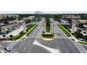 Community entrance with an archway and fountain at 8157 Roseville Blvd, Davenport, FL 33896