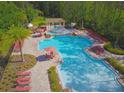 Resort-style pool with spa and plenty of lounge chairs at 8157 Roseville Blvd, Davenport, FL 33896