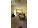 Living room with dining area and seating at 4000 Santa Maria Dr # 108, Kissimmee, FL 34741