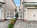 Private gated entry to townhome with brick pavers at 8311 Foster Dr, Davenport, FL 33896