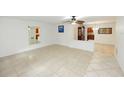 Spacious living room with tile floors and neutral walls at 1889 Seclusion Dr, Port Orange, FL 32128