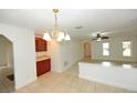 Bright dining room with tile floors and wood cabinetry at 1889 Seclusion Dr, Port Orange, FL 32128