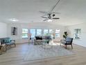 Spacious living room featuring hardwood floors and ample natural light at 1622 Tally Ho Dr, Lakeland, FL 33810