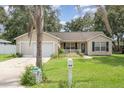 Charming single story home with attached garage and well-maintained lawn at 1691 Cr 607C, Bushnell, FL 33513