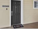 Condo entrance with a dark gray door and a welcome mat at 3050 Pirates Retreat Ct # 502, Kissimmee, FL 34747