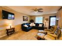 Comfortable living room with leather furniture and TV at 3200 River Ranch Blvd # 160, River Ranch, FL 33867