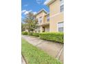 Townhouse exterior with landscaping and walkway at 5333 River Rock Rd, Lakeland, FL 33809