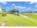 Landscaped backyard with pond view and highway access at 5333 River Rock Rd, Lakeland, FL 33809