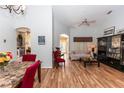 Living room with hardwood floors, a large cabinet and comfortable seating at 107 Needlewood Loop, Debary, FL 32713