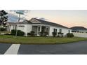 Single-story house with attached garage and screened porch at 4415 Casey Ct, The Villages, FL 32163