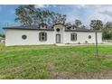Newly built home with white exterior and black accents at 225 Diesel Rd, Mulberry, FL 33860
