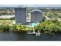 Aerial of two high rise buildings, pool, and dock at 13415 Blue Heron Beach Dr # 1101, Orlando, FL 32821