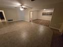 Spacious living room featuring tile floors and a brick fireplace at 3414 Portersfield Rd, Orlando, FL 32808