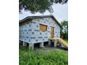 New house under construction, exterior wrap, steps, and small deck at 2330 Greenway, Sanford, FL 32771