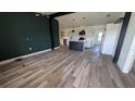 Modern kitchen features island, stainless steel appliances, and dark wood flooring at 1049 Edith Ave, Lakeland, FL 33805