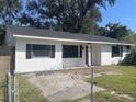 Newly renovated home with a red door and shutters at 1049 Edith Ave, Lakeland, FL 33805